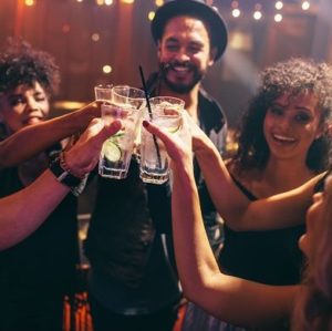 Friends having drinks at the night club party