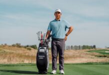 Yanhan Zhou standing beside a Callaway golf bag after signing a multi-year equipment endorsement agreement with the brand.