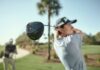 Golfer completing a tee shot with a Srixon ZXi RKT driver in the foreground.