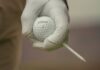 SMOTHERMAN LEADS TITLEIST SUCCESS ACROSS THREE TOURS Gloved golfer holding a Titleist golf ball on the course